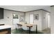 The dining area features a wooden table with modern white chairs and stylish accents at 525 Railed Ridge Way, Moncks Corner, SC 29461