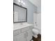 Well-lit bathroom with single sink vanity, framed mirror, and tub with shower at 5254 Mulholland Dr, Summerville, SC 29485