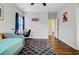 Bedroom with ceiling fan, daybed, desk, wood floors, and a neutral color palette at 5254 Mulholland Dr, Summerville, SC 29485