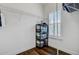 Walk-in closet with shelving, dark wood floor, and natural light from a shuttered window at 5254 Mulholland Dr, Summerville, SC 29485