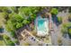 Aerial view of a community pool with ample seating, playground, and parking at 5254 Mulholland Dr, Summerville, SC 29485