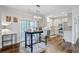 Dining area with a light fixture and wood floors is conveniently located off of the updated kitchen at 5254 Mulholland Dr, Summerville, SC 29485