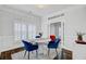 Elegant dining room with shuttered windows, a round table, and sophisticated decor at 5254 Mulholland Dr, Summerville, SC 29485