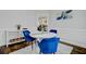 Dining area featuring a modern round table with blue velvet chairs and a display cabinet at 5254 Mulholland Dr, Summerville, SC 29485