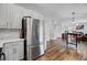 The spacious kitchen with stainless steel appliances seamlessly connects to the dining and living areas at 5254 Mulholland Dr, Summerville, SC 29485