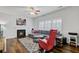 Inviting living room showcases a fireplace, plush sectional, and natural light from the windows at 5254 Mulholland Dr, Summerville, SC 29485