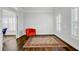Office space with a patterned rug, a bold orange chair, and natural light at 5254 Mulholland Dr, Summerville, SC 29485