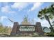 Oak Forest Village entrance sign with brick columns and beautiful landscaping at 5254 Mulholland Dr, Summerville, SC 29485
