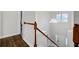 Bright entryway with a chandelier, white walls, and a wood and white staircase leading to the front door at 5254 Mulholland Dr, Summerville, SC 29485