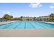 Community pool with ample seating and shade structures for residents at 5254 Mulholland Dr, Summerville, SC 29485