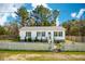 Charming single-story home with white picket fence and manicured landscaping at 5638 Dixie Plantation Rd, Hollywood, SC 29449
