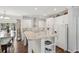 Modern kitchen with white cabinets, stainless steel appliances, and island at 5638 Dixie Plantation Rd, Hollywood, SC 29449