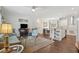 Open-concept living room with hardwood floors and ample natural light at 5638 Dixie Plantation Rd, Hollywood, SC 29449