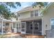 Exterior backyard showing the home's screened-in porch and HVAC at 601 Buckthorn Cir, Summerville, SC 29483