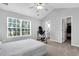 Bright bedroom with vaulted ceiling, ceiling fan, large window, and an ensuite bathroom at 601 Buckthorn Cir, Summerville, SC 29483