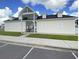 Community clubhouse with gated entry, dormer windows and ample parking spaces at 601 Buckthorn Cir, Summerville, SC 29483