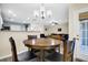 Dining area with a table and chairs, featuring a view to the living area at 601 Buckthorn Cir, Summerville, SC 29483