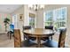 Bright dining area with natural light and a stylish chandelier at 601 Buckthorn Cir, Summerville, SC 29483