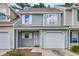 Townhome showing siding, white trim, and attached garage at 601 Buckthorn Cir, Summerville, SC 29483