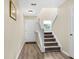 Bright foyer with hardwood floors and a staircase with a white banister leading upstairs at 601 Buckthorn Cir, Summerville, SC 29483