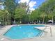 Community pool with lounge chairs, trees, and tidy landscaping at 601 Buckthorn Cir, Summerville, SC 29483