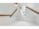 Bright attic space with exposed wooden beams, a window letting in natural light, and white painted floors at 61 Tradd St, Charleston, SC 29401