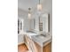Luxurious bathroom featuring marble countertops, dual sinks, and modern lighting fixtures at 61 Tradd St, Charleston, SC 29401