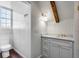 Stylish bathroom featuring marble countertop, vanity with storage, and natural light from the window at 61 Tradd St, Charleston, SC 29401