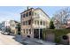 Charming traditional-style home with a double balcony, shuttered windows, and an ivy-covered garage at 61 Tradd St, Charleston, SC 29401
