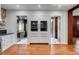 Modern kitchen with stainless steel appliances, custom cabinetry, and checkerboard-patterned flooring at 61 Tradd St, Charleston, SC 29401