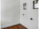 A laundry room with utility hookups and wood-look flooring at 61 Tradd St, Charleston, SC 29401