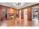 Hardwood-paneled living room featuring a fireplace and doorway views into other rooms at 61 Tradd St, Charleston, SC 29401
