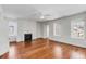 Spacious living room featuring hardwood floors, a classic fireplace, and plenty of natural light at 61 Tradd St, Charleston, SC 29401