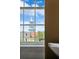 Captivating view of a church steeple through a window, highlighting the city's architecture and charm at 61 Tradd St, Charleston, SC 29401