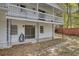 Shot of the house from the yard, showing the balcony, patio, and decorative wrought iron supports at 703 Canary Dr, Charleston, SC 29414