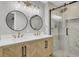 Bathroom featuring double sink vanity with modern fixtures and glass enclosed shower at 703 Canary Dr, Charleston, SC 29414