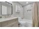 Well-lit bathroom features modern fixtures, a shower-tub combo with tiled walls, and stylish vanity at 703 Canary Dr, Charleston, SC 29414