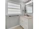 Stylish bathroom with a modern vanity, updated fixtures, and marble countertop at 703 Canary Dr, Charleston, SC 29414