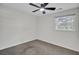 Cozy bedroom featuring neutral carpet, ceiling fan, and ample natural light at 703 Canary Dr, Charleston, SC 29414