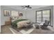 Cozy bedroom featuring a ceiling fan and access to outdoor patio at 703 Canary Dr, Charleston, SC 29414