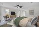 Bedroom featuring ensuite bathroom, TV, and closet with mirrored doors at 703 Canary Dr, Charleston, SC 29414