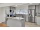 Modern kitchen features stainless steel appliances, stone countertops, and ample cabinet space at 703 Canary Dr, Charleston, SC 29414