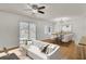Cozy living area showcasing the seamless transition to dining area and outdoor patio at 703 Canary Dr, Charleston, SC 29414