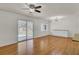 Bright, open living space featuring hardwood floors and view to the patio at 703 Canary Dr, Charleston, SC 29414