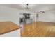Open living area featuring hardwood floors and a seamless transition to the modern kitchen at 703 Canary Dr, Charleston, SC 29414