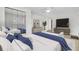 The beautifully staged bedroom offers a tranquil retreat, with a luxurious bed and mirrored closet at 703 Canary Dr, Charleston, SC 29414