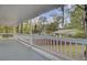 Back porch featuring swing and views of backyard and neighboring homes at 703 Canary Dr, Charleston, SC 29414