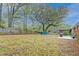 Large backyard offering shade, a concrete patio, storage shed, and plenty of room to enjoy at 746 Cartwright Dr, Charleston, SC 29414