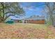Expansive backyard featuring mature trees, a storage shed, and ample space for outdoor activities at 746 Cartwright Dr, Charleston, SC 29414