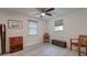 Light-filled bedroom with neutral walls, laminate floors, ceiling fan, and two windows with blinds at 746 Cartwright Dr, Charleston, SC 29414